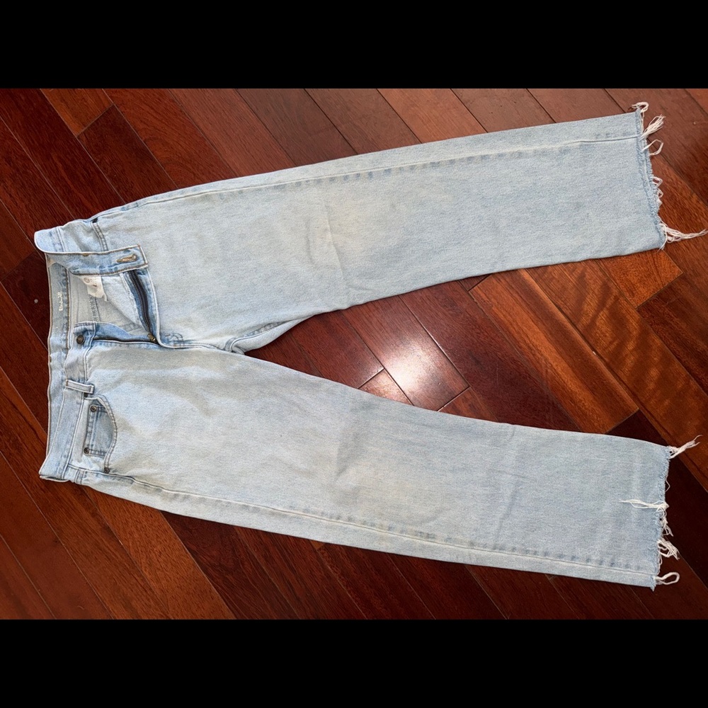 Cut and frayed vintage denim jeans